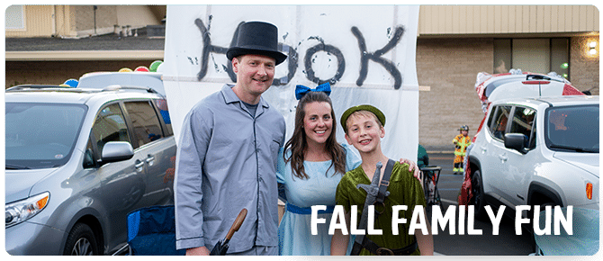Family in costume at their decorated trunk at Fall Family Fun